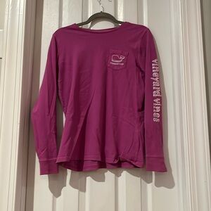 Dark pink long sleeved shirt with a pocket on the front with a whale on it